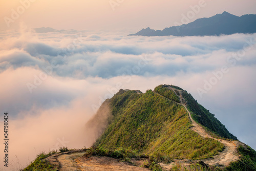 Ta Xua is a famous mountain range in northern Vietnam. All year round, the mountain rises above the clouds creating cloud inversions. photo