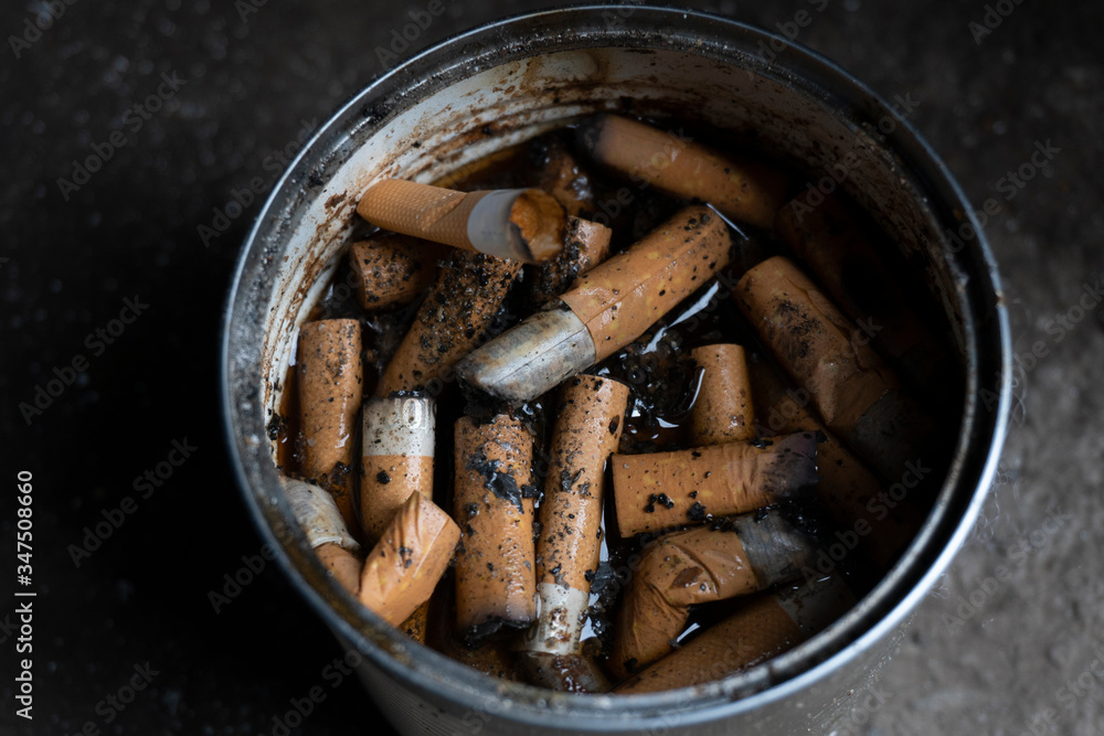 Cigarette butts in a makeshift can of drug addicts Cigarette butts in a makeshift can of drug addicts