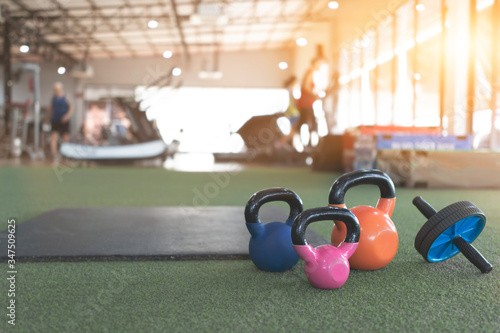 Billede på lærred Close up kettlebells and roller on gym.