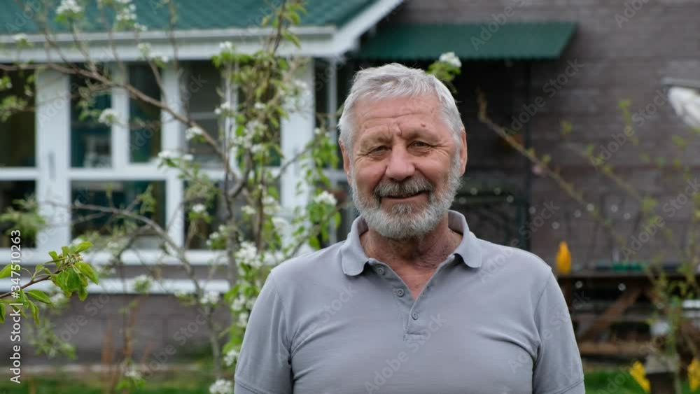 Senoir elderly man with kind happy face looking at camera, outdoors at his house Senoir elderly man with kind happy face looking at camera, outdoors at his house