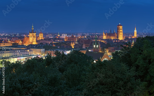 Old Town of Gdansk in dusk, Poland; view from Gradowa Hill. Main visible sights (from left to right): St. Catherine's Church, St. John's Church, Main railway station, St. Mary's Church, Main Town Hall