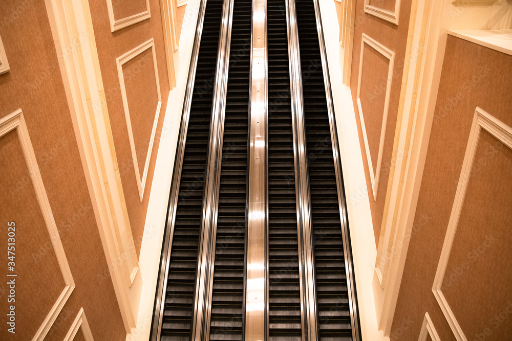 Up and down escalators inside unknown hotel lobby Up and down escalators inside unknown hotel lobby