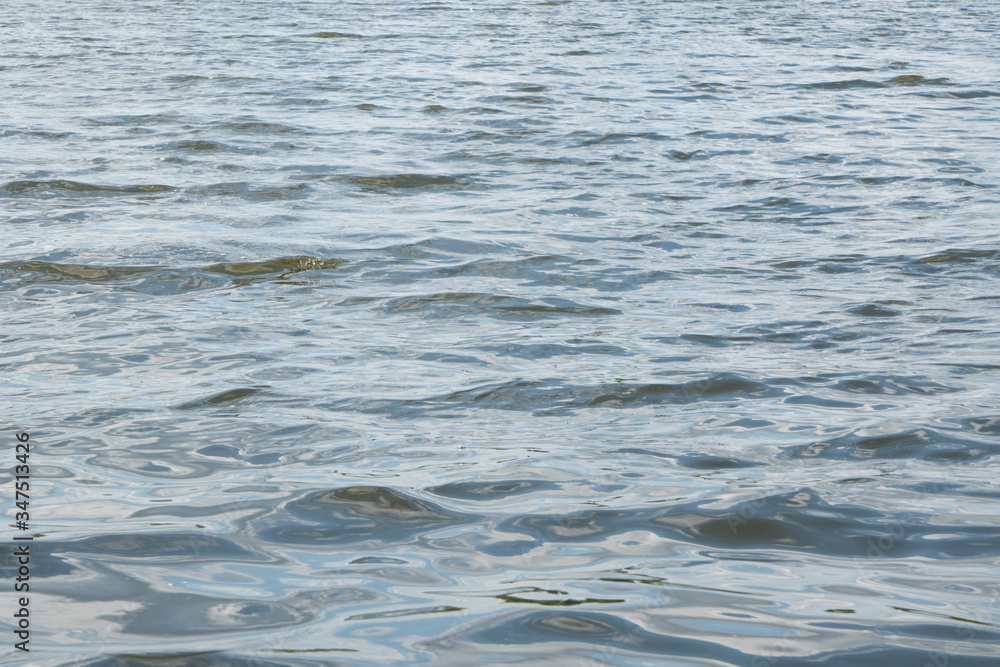 river waves in windy weather on a sunny day river waves in windy weather on a sunny day