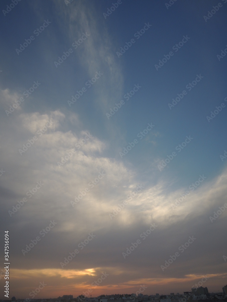 Naklejka premium sunset with blue sky ,clouds and rddishness