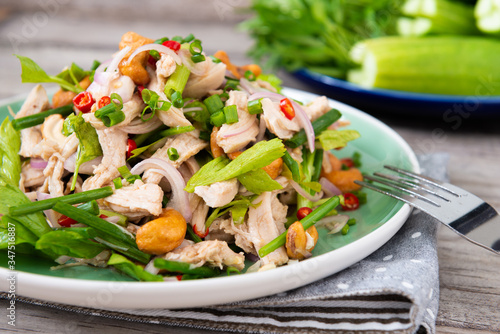 Steamed rip chicken spicy salad with shallot, celery, chili and Scallion.