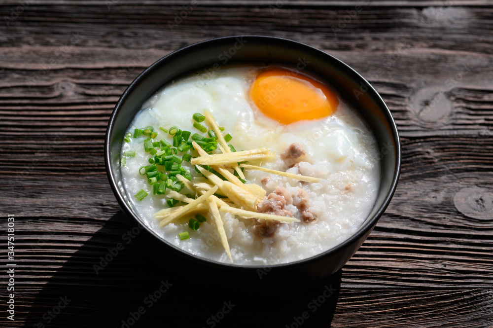 Rice gruel or congee with egg ,pork and vegetable Rice gruel or congee with egg ,pork and vegetable