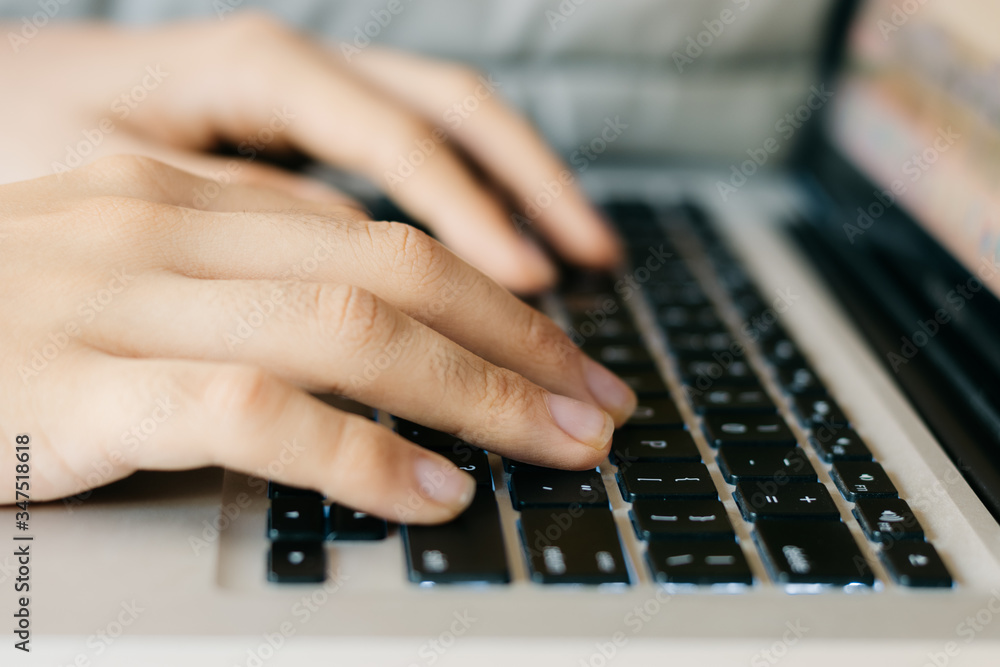 hands typing on a keyboard hands typing on a keyboard