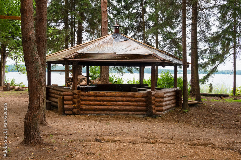 Beautiful gazebo in the woods next to the lake on an autumn day Beautiful gazebo in the woods next to the lake on an autumn day