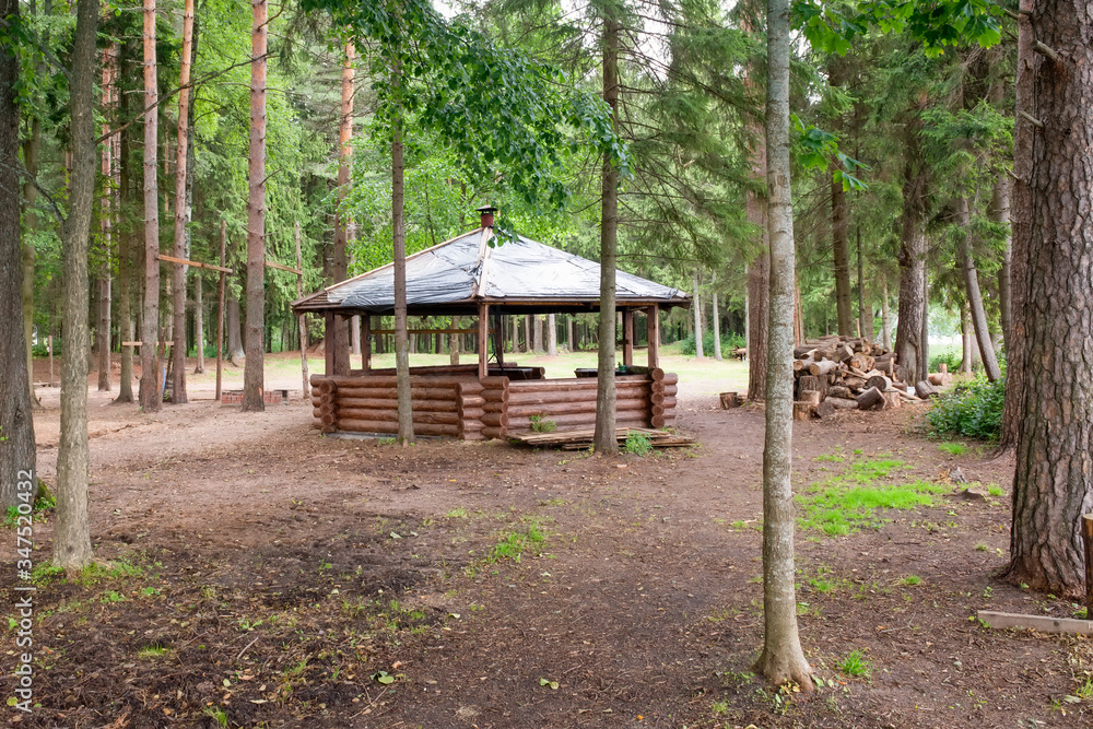Beautiful gazebo in the woods next to the lake on an autumn day Beautiful gazebo in the woods next to the lake on an autumn day