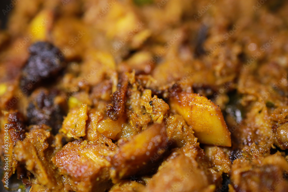 South Indian dish spicy beef fry Kerala, India. side dish ghee rice, appam, parotta, puttu, bread and chappathi, Kerala cuisine ,Buffalo roast / Meat pepper fry with coconut. India spices cooking, South Indian dish spicy beef fry Kerala, India. side dish ghee rice, appam, parotta, puttu, bread and chappathi, Kerala cuisine ,Buffalo roast / Meat pepper fry with coconut. India spices cooking,