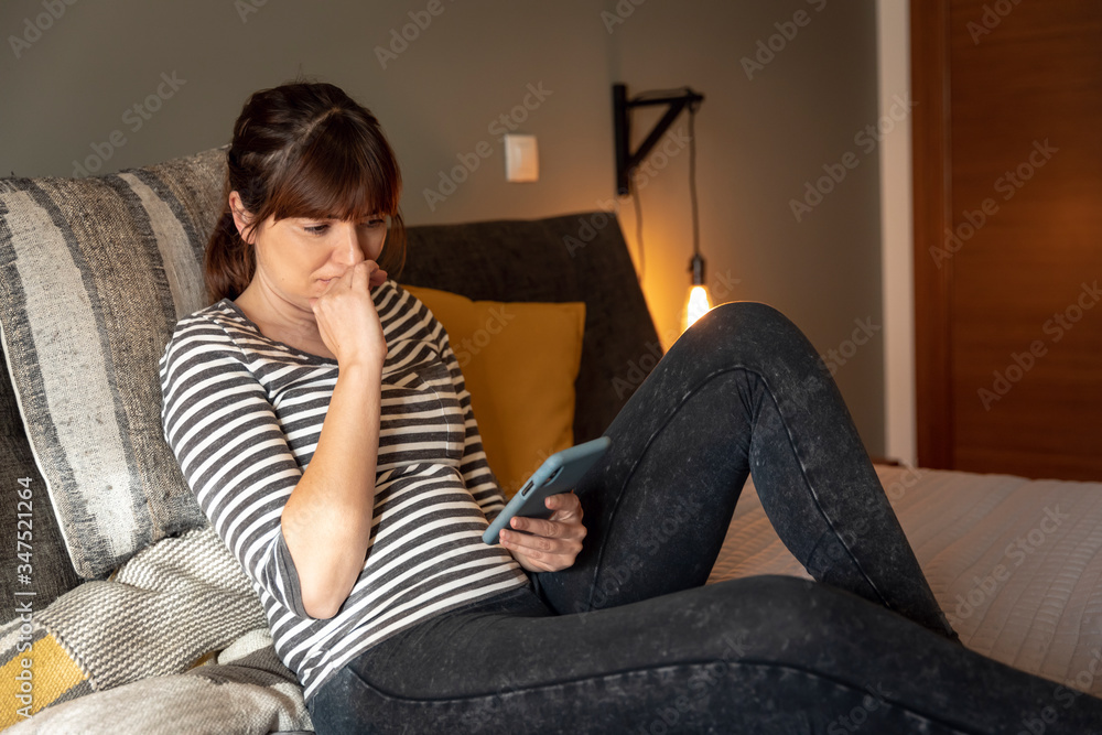 Obraz premium Sad woman at home
