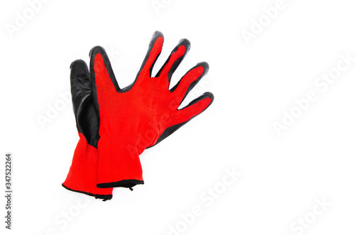 Gloves for workers, construction red with black rubber coating. Black-red gloves. Gloves on a white background, palm up, down. Glove on  glove