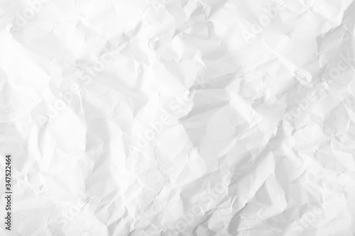 Crumpled wrinkled white office paper background, texture of writing paper with wrinkles