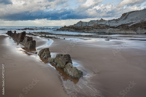 Rocky beach at dusk photo