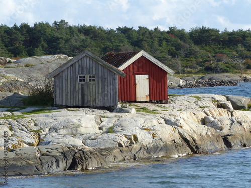 Burgundy wooden houses and landscapes in the Koster, Sydkoster and Nordkoster islands. Archipielago of Kosterhavets Nationalpark. Stromstad. Bohuslan. Sweden.
