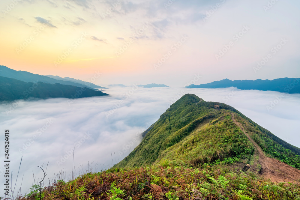 Ta Xua is a famous mountain range in northern Vietnam. All year round, the mountain rises above the clouds creating cloud inversions.
