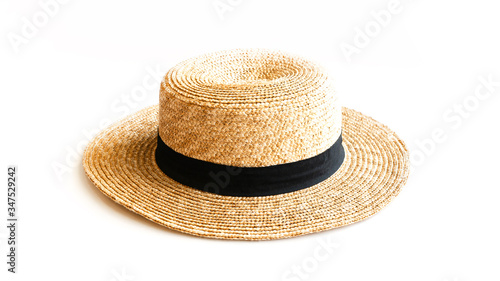 Flat lay of straw hat isolated on white background. Close up