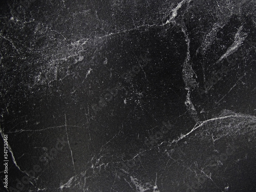 black marble surface and striped image background on black     