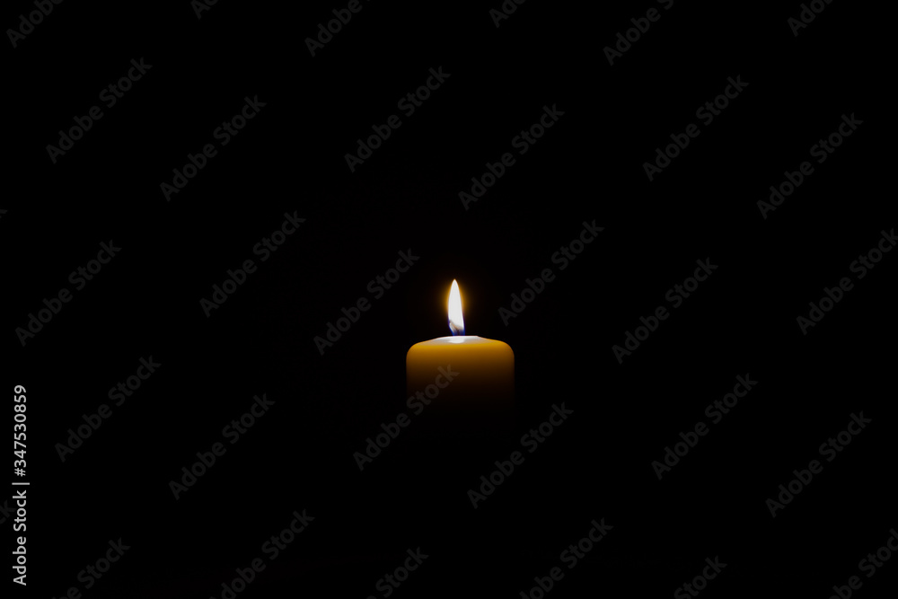 burning candle isolated on black. backgrounds and textures burning candle isolated on black. backgrounds and textures