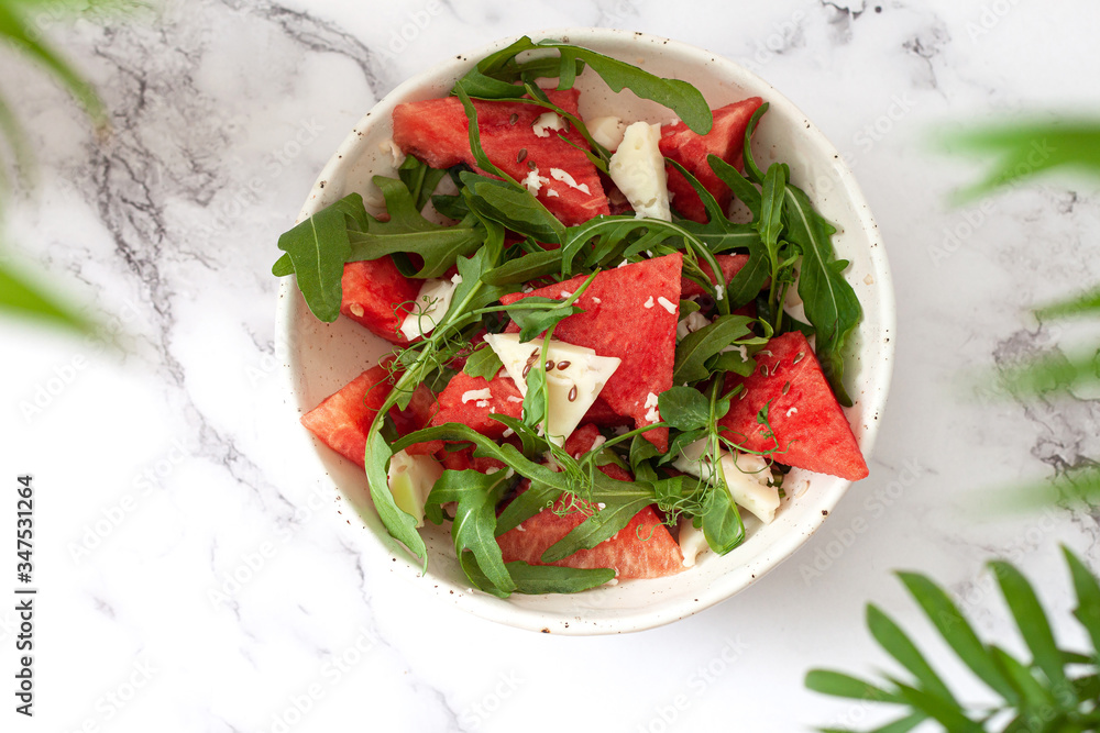 Watermelon salad in a jar with feta and arugula.Summer food