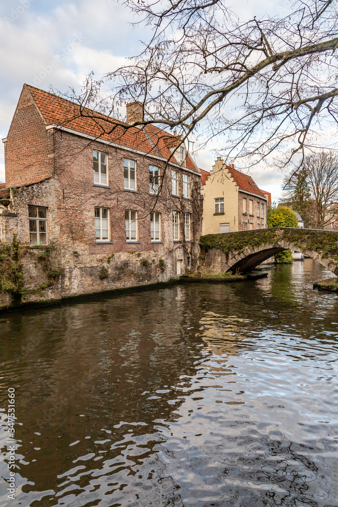Buildings around channels and bridge in Bruges Buildings around channels and bridge in Bruges