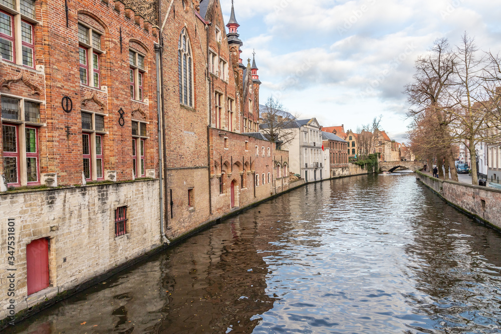 Buildings around channels and bridge in Bruges