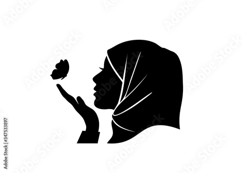 silhouette vector of beauty hijab women looking butterfly in her hand photo