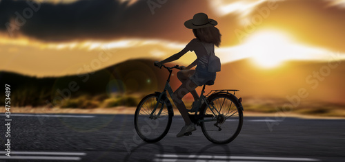 a Silhouette girl riding on cycle on-road an at evening sunset outdoor mountains. © Njay