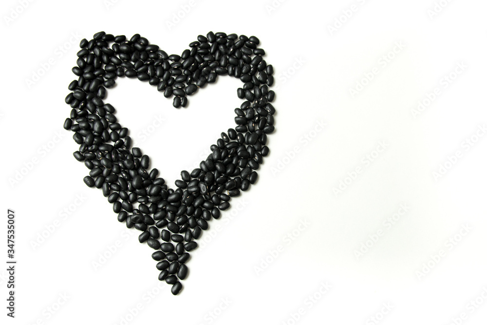 Pile of raw Brazilian Black Beans. Also know as 'Feijao' Heart Shape