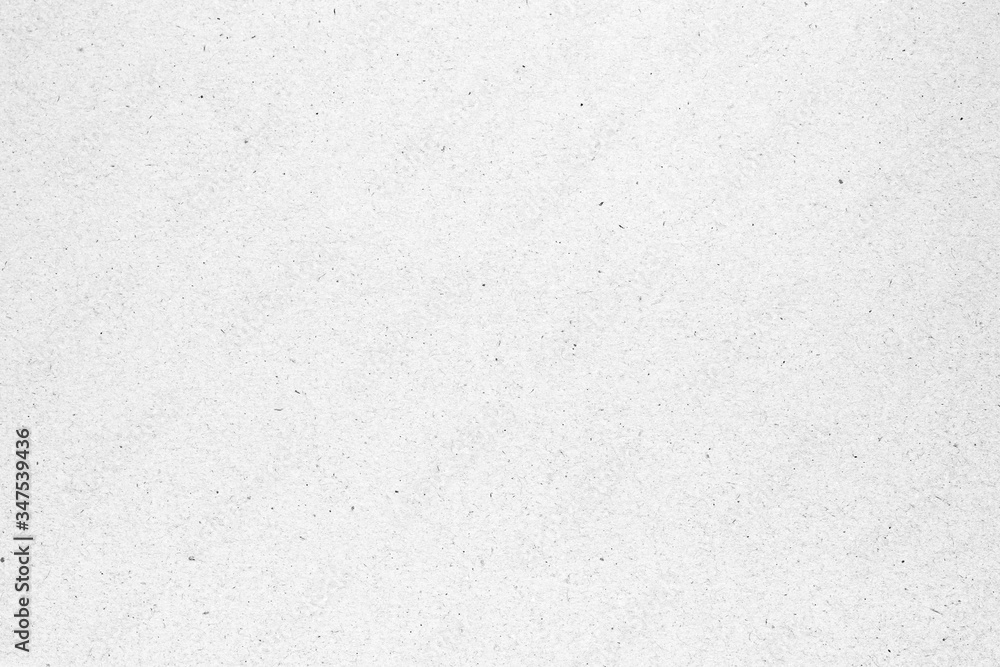 White paper or cardboard texture with black spot background. White paper or cardboard texture with black spot background.
