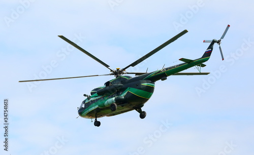 Fototapeta Naklejka Na Ścianę i Meble -  Walking helicopter in the sky, St. Petersburg, Russia, July 2018