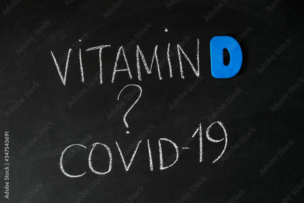 Fototapeta premium Vitamin D help in treating coronavirus. Vitamin D, coronavirus and question mark drawing on chalkboard