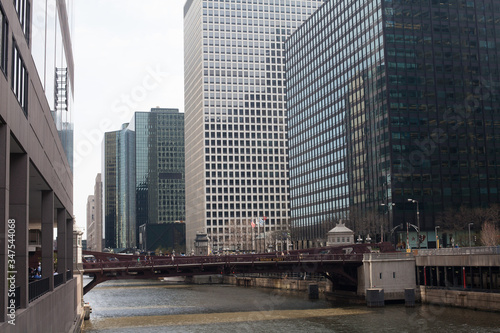 Bridge Over Canal Amidst Modern Buildings In City #347544068