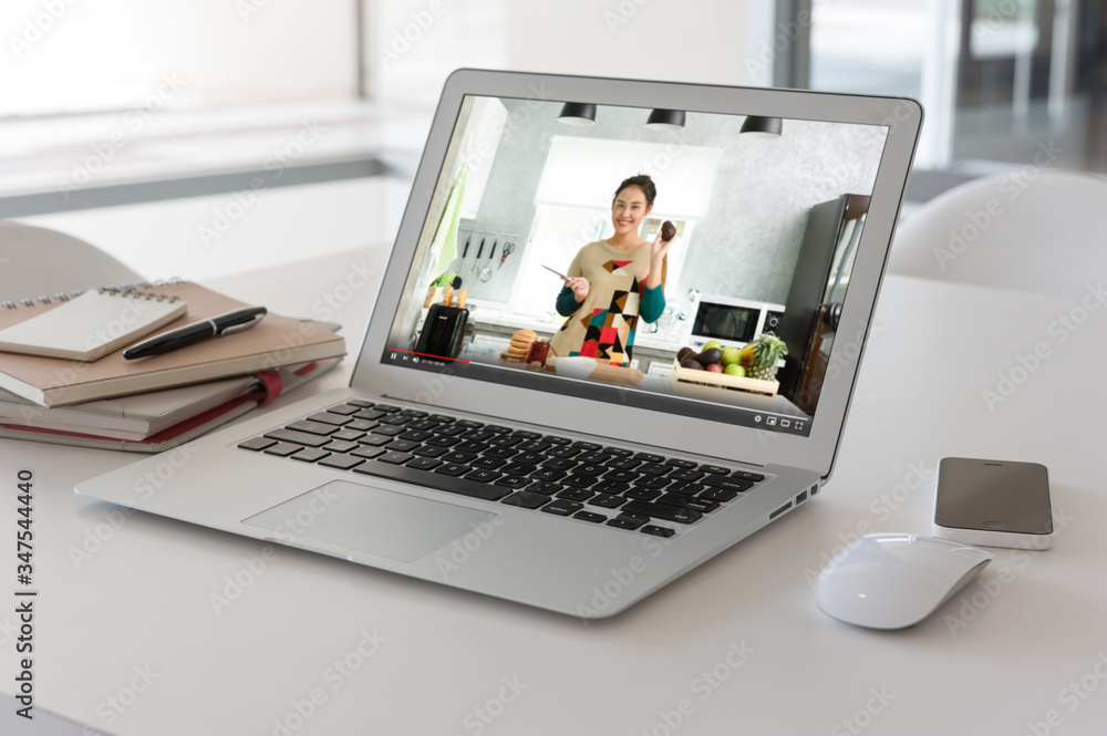 Computer laptop with screen of course online of young teenager teach about cooking healthy food Computer laptop with screen of course online of young teenager teach about cooking healthy food