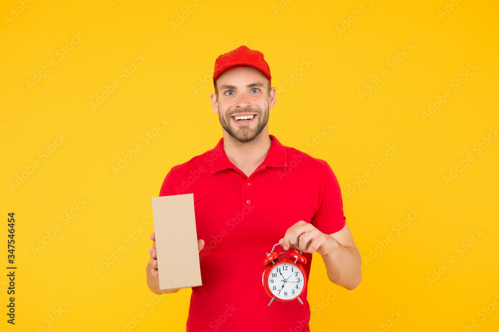 delivery time. Delivery Courier with time clock holding box. take your parcel. gift delivery man holding vintage clock. go online shopping. Delivery during quarantine. friendly staff man