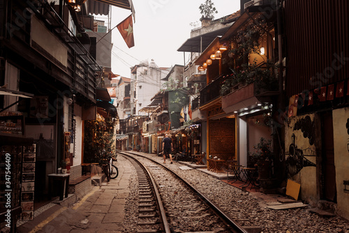 Railway in the city through the streets between old houses, Hanoi, Vietnam.