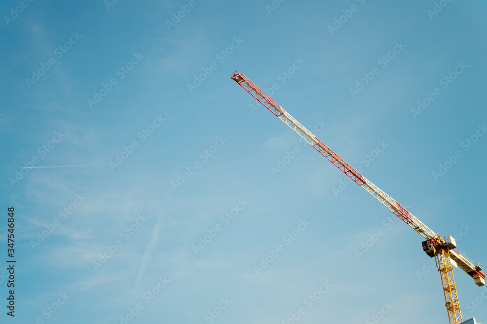 Building future together. Construction crane sky copy space. Architecture and building. Technology and industry. Development concept. Tower crane. High tower crane. Rent construction equipment Building future together. Construction crane sky copy space. Architecture and building. Technology and industry. Development concept. Tower crane. High tower crane. Rent construction equipment