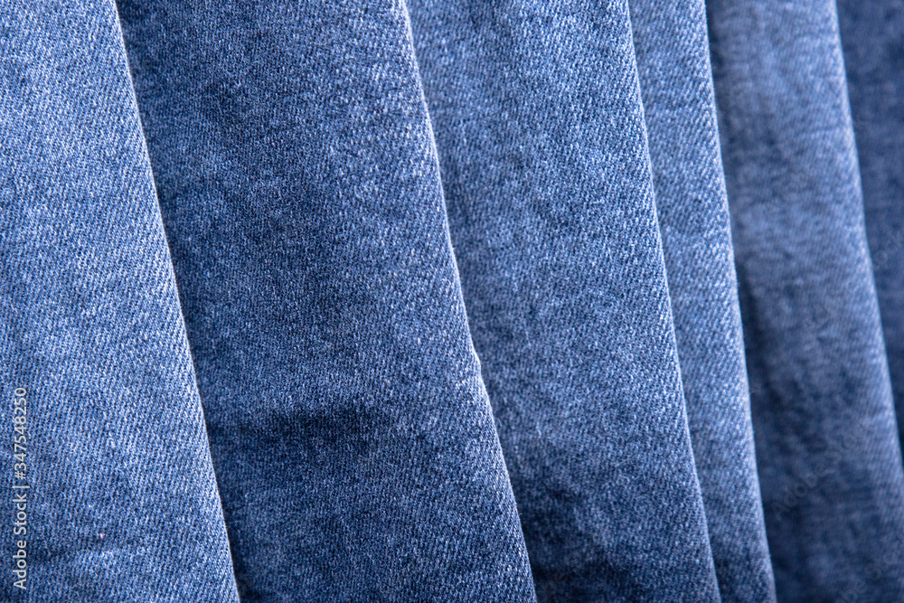 Naklejka premium back pocket of denim trousers. with ripped denim jeans close up for pregnant women