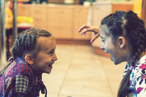 Stock photo  an image of two girls fighting and shouting. toned