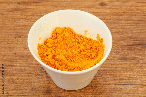 Tumeric powder in the bowl