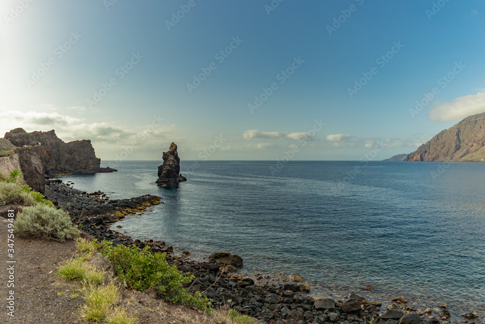 Roque de Bonanza is one of the symbols of El Hierro island and its natives. Huge Rock sticking out of the water on the las Almorranas beach. El Hierro, Canary islands Spain