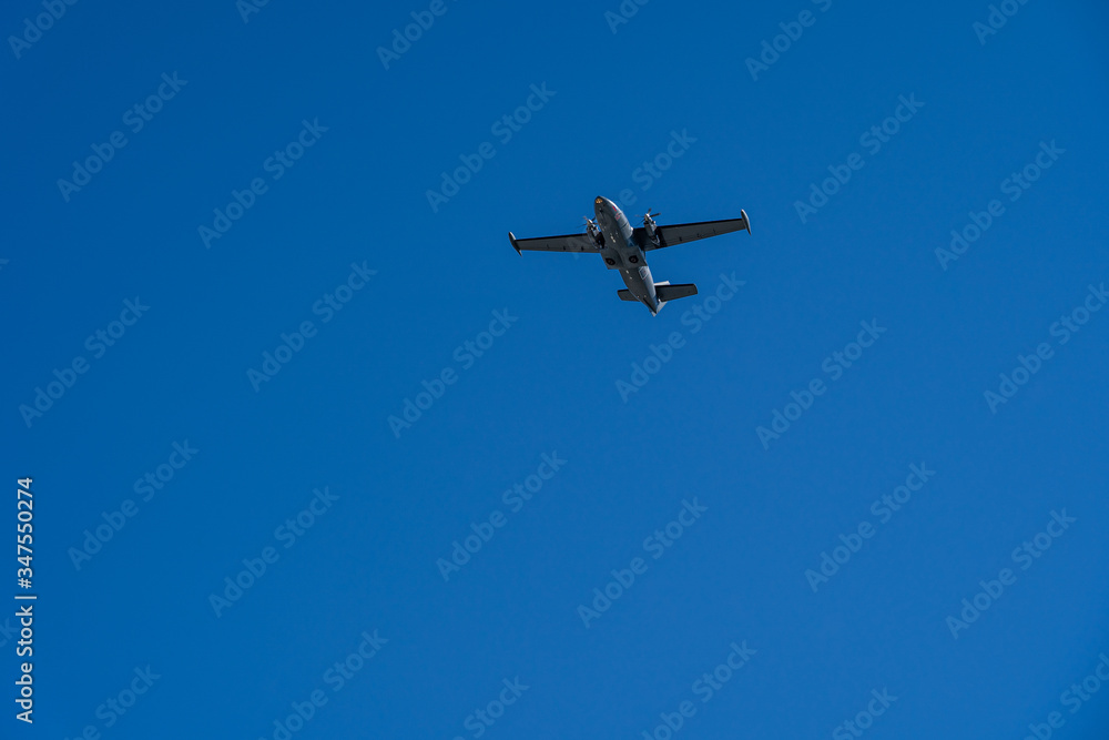 One aircraft of russian air forces is flying at airshow on bright blue sky One aircraft of russian air forces is flying at airshow on bright blue sky