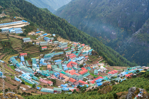 An Amphitheatre view of Namche Bazaar on a mountain slope in Nepal. Namche Bazaar is a beautiful town of Sherpas, also known as a gateway to the Everest Base Camp Trek.