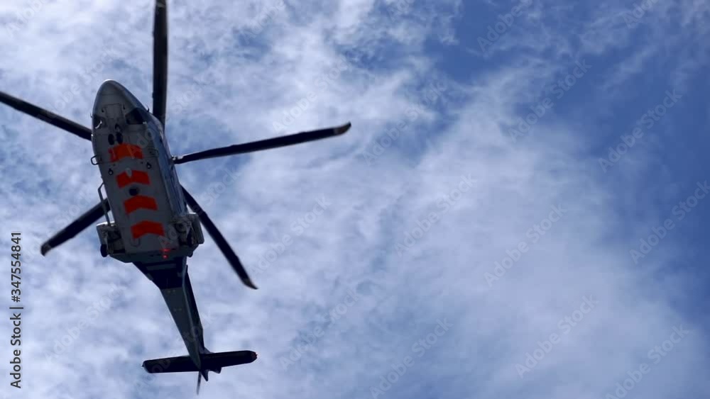 Low angle view of slow motion helicopter moving, Helicopter is one of air transportation, transfer workers to offshore oil and gas platform, air transportation for support passengers.