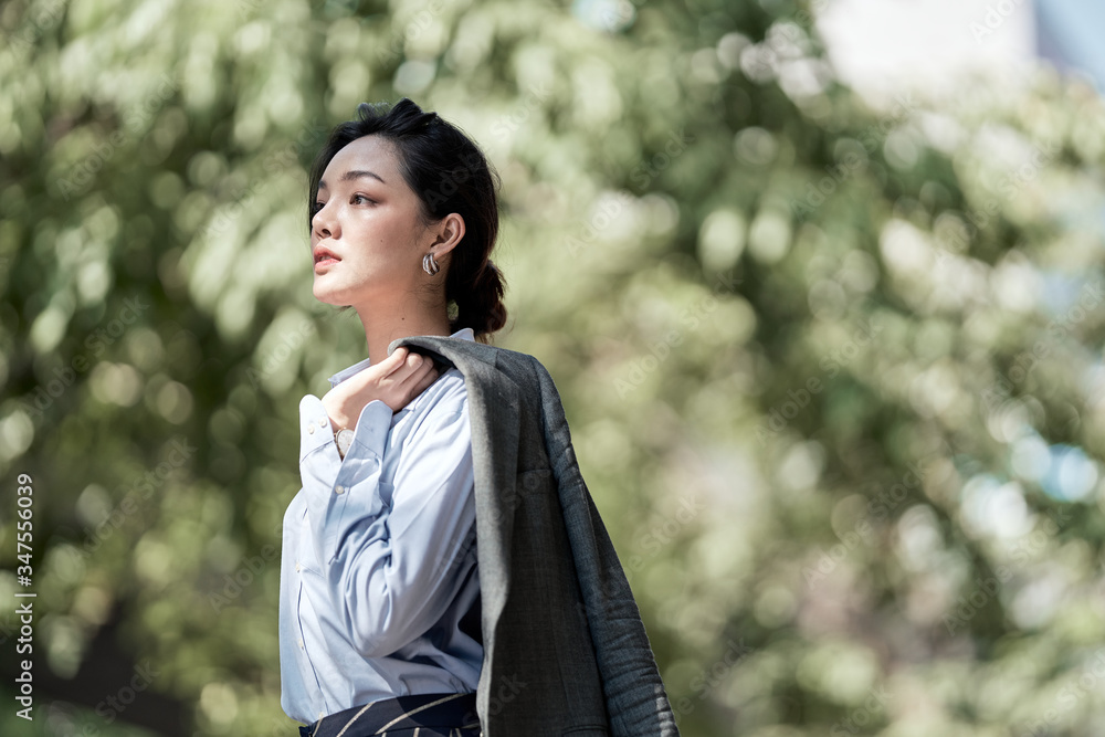 A beautiful Asian business woman is looking forward for her future. A beautiful Asian business woman is looking forward for her future.