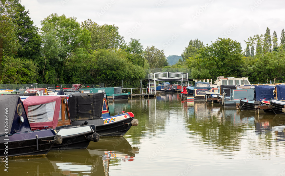 Narrow boats at a Midlands marina. These are leisure craft used by weekenders and vacationers.