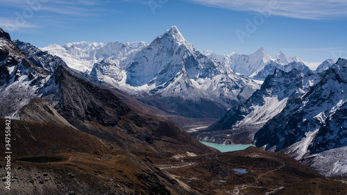 Scenic view of mountain peaks  valleys and lake in the Himalayas. Ama Dablam mountain from western side. View after crossing Chola Pass.