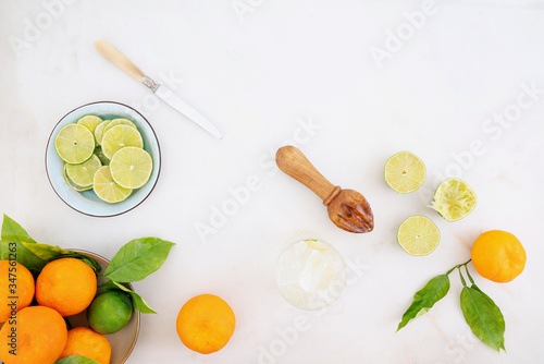 Citrus infused water preparation. Fresh oranges and limes