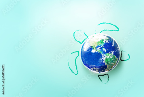World Turtle Day and save our Sea Concept, May 23, Globe earth with turtle on the light blue green background, Elements of this image furnished by NASA