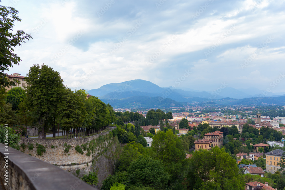 Summer European city skyline. Top down city view. Italian city landscape. View of Bergamo city. Italy. Summer European city skyline. Top down city view. Italian city landscape. View of Bergamo city. Italy.